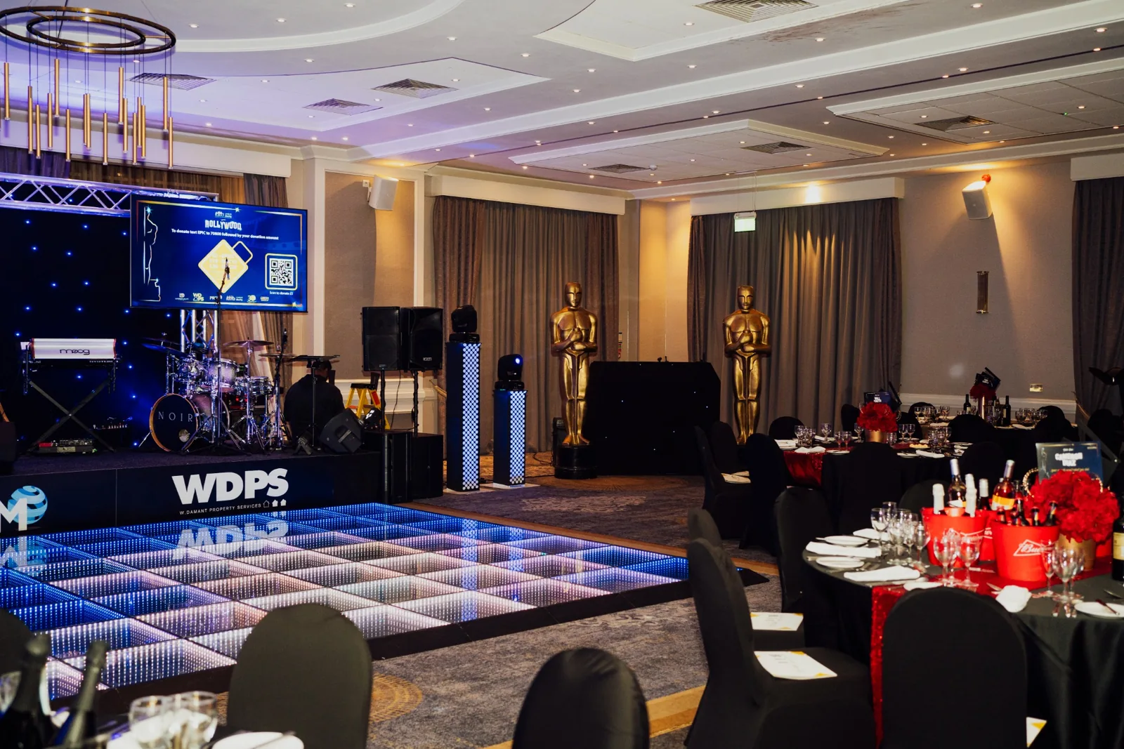 UHNM Hollywood charity ball venue with illuminated dance floor and stage